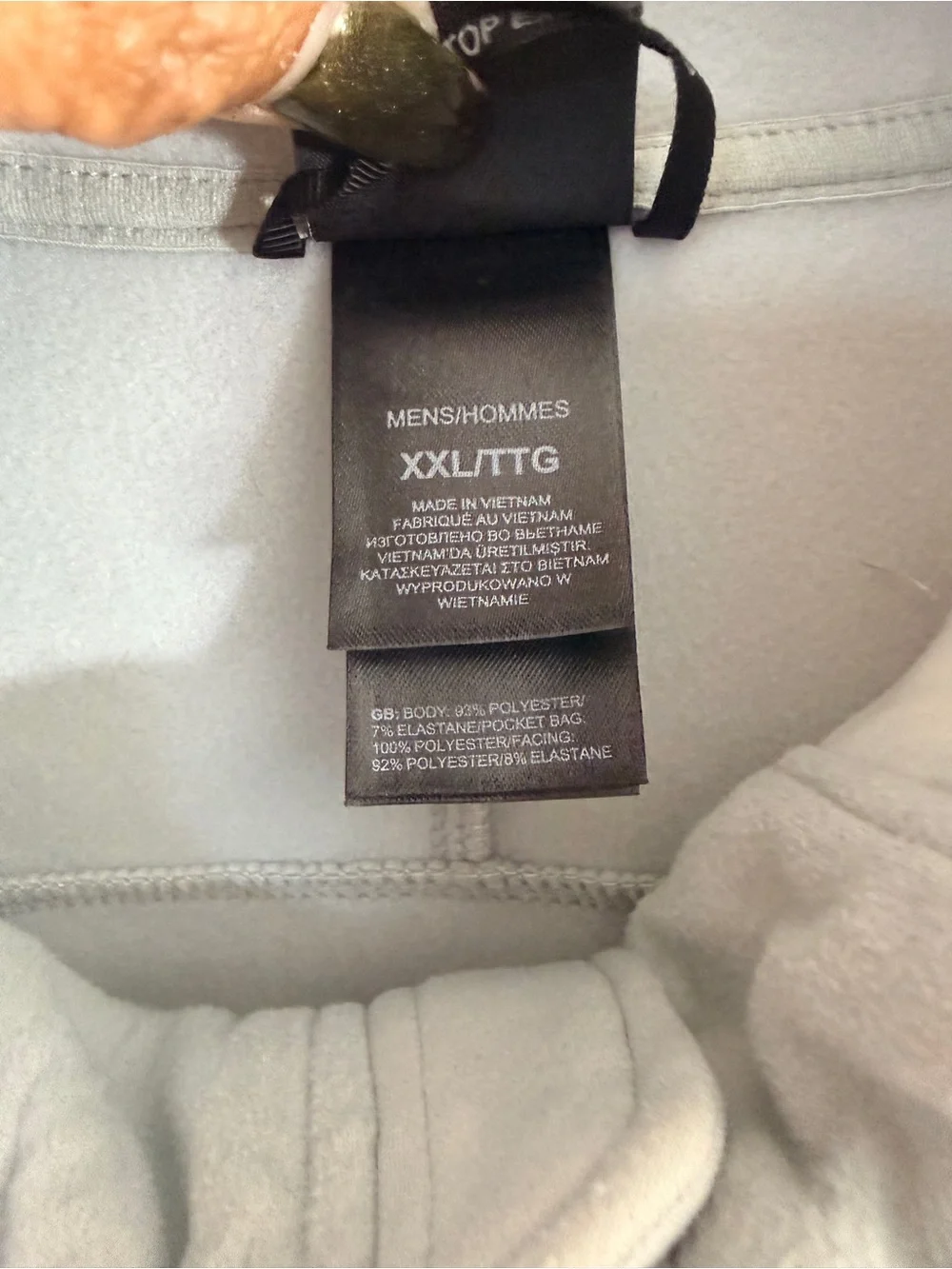 The North Face Light Gray Jacket with Black Logo Tag